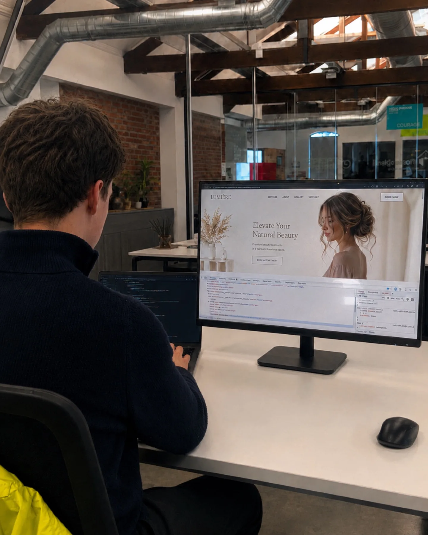 Eoghan Collins building a salon website mockup at his desk